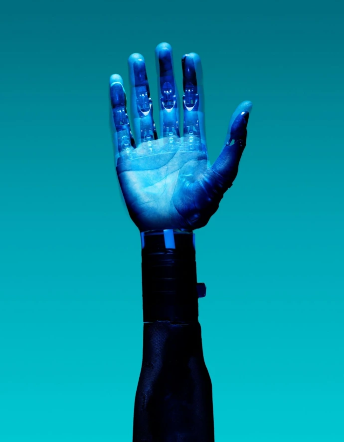 blue robotic prosthetic hand against teal background